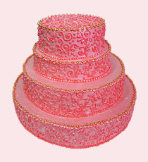 Торт в красно-розовой гамме с завитками из крема